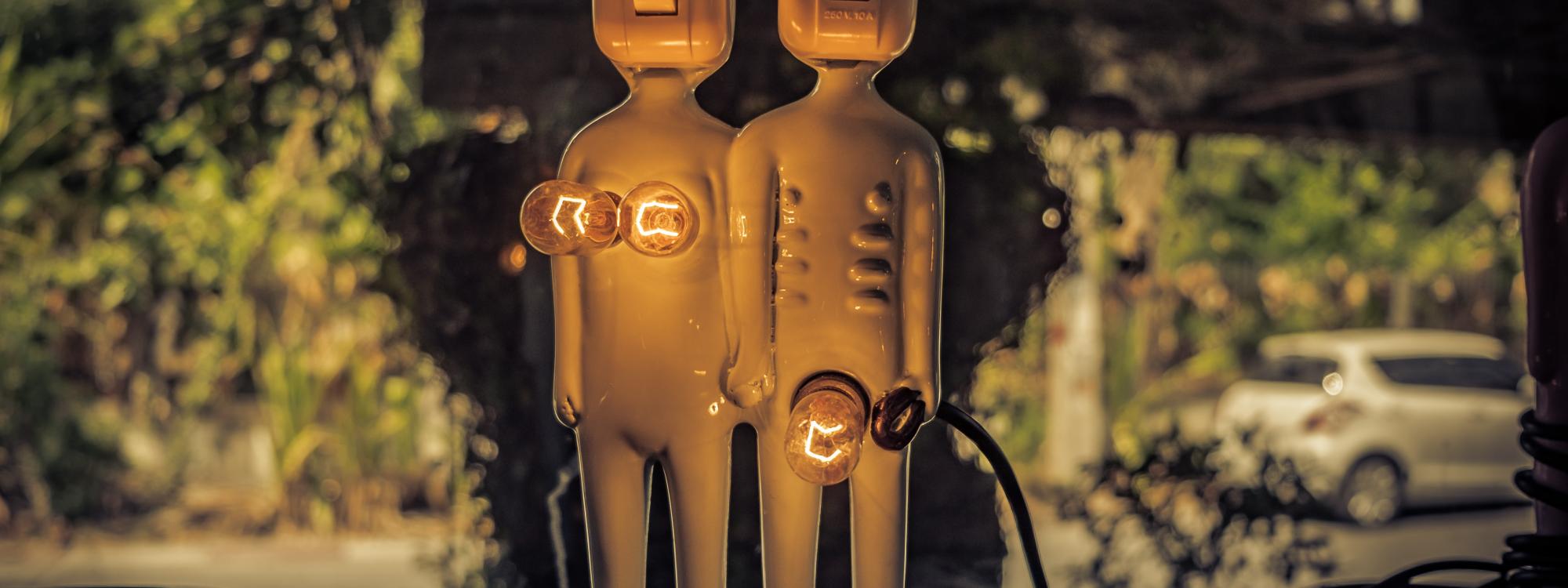 Power plugs in the shape of a man and woman's body