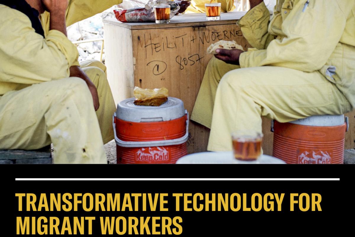 Workers talking on mobile and eating lunch