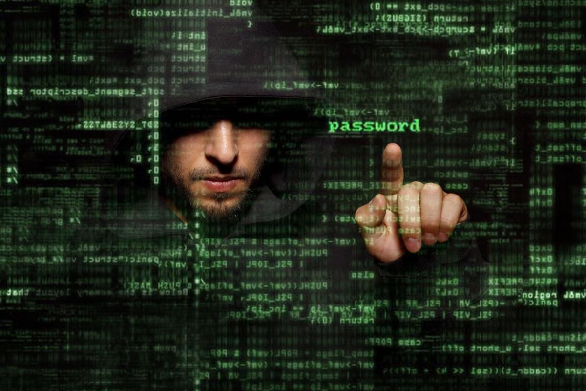Hooded man pushing the word password