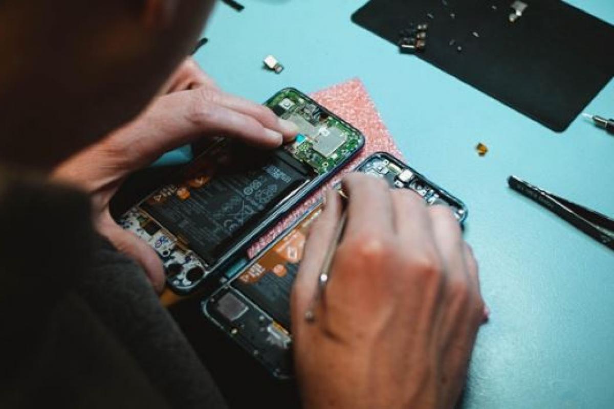 Someone repairing a technology board